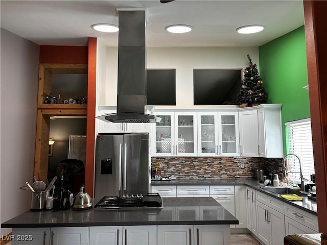 3601 Slapton Ave, North Las Vegas, NV 89031 - kitchen featuring appliances with stainless steel finishes, wall chimney range hood, dark countertops, and white cabinetry
