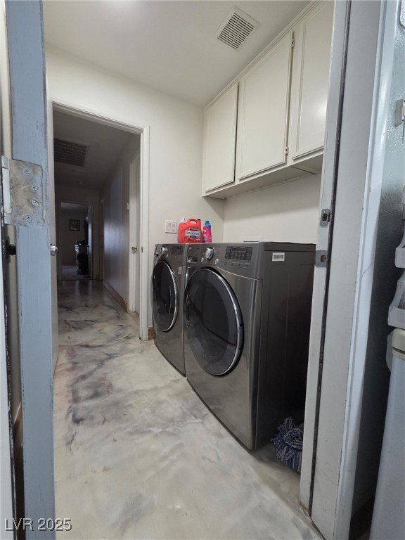 3601 Slapton Ave, North Las Vegas, NV 89031 - washroom with cabinet space and washer and clothes dryer
