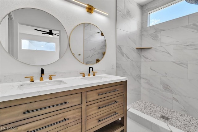 8944 W Rochelle Ave, Las Vegas, NV 89147 - full bathroom featuring double vanity, a tile shower, and ceiling fan