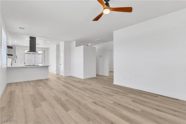 8944 W Rochelle Ave, Las Vegas, NV 89147 - unfurnished living room with a ceiling fan and light wood-style floors