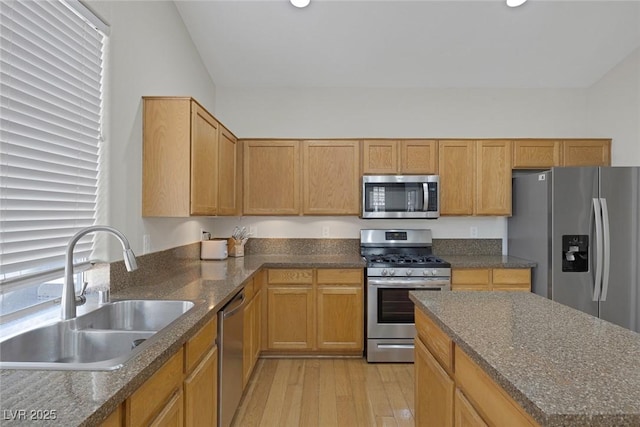 5512 Goldbrush St, Las Vegas, NV 89130 - kitchen with appliances with stainless steel finishes, light wood finished floors, dark stone countertops, and recessed lighting