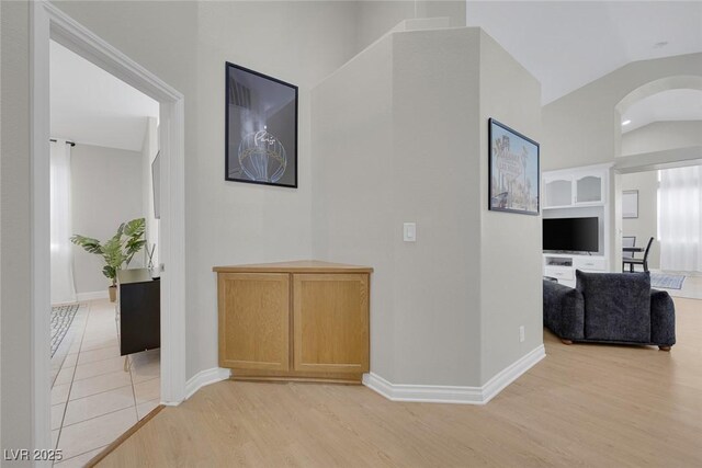 5512 Goldbrush St, Las Vegas, NV 89130 - hall featuring light wood-type flooring and lofted ceiling