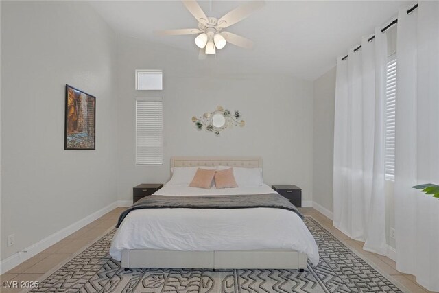 5512 Goldbrush St, Las Vegas, NV 89130 - bedroom with lofted ceiling, multiple windows, light tile patterned floors, and a ceiling fan