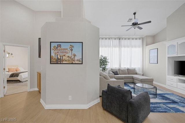 5512 Goldbrush St, Las Vegas, NV 89130 - living room featuring a ceiling fan, light wood finished floors, and high vaulted ceiling