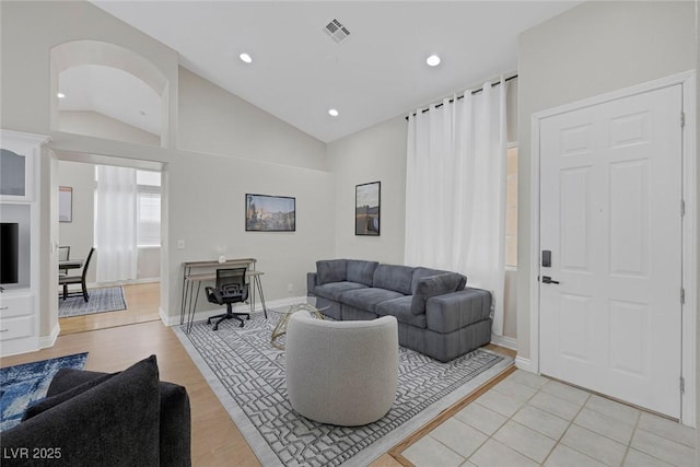 5512 Goldbrush St, Las Vegas, NV 89130 - living area with lofted ceiling, light wood-style floors, and recessed lighting