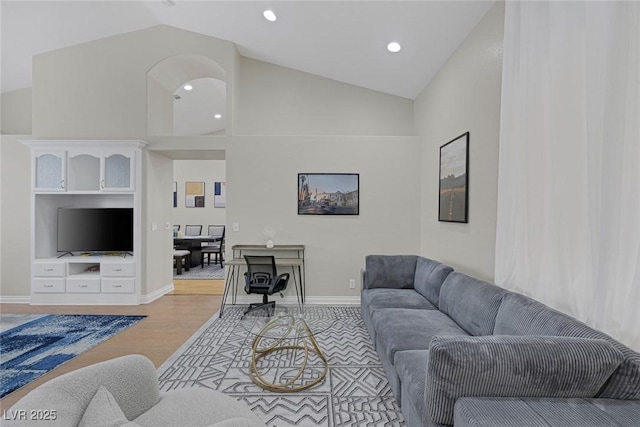 5512 Goldbrush St, Las Vegas, NV 89130 - living area featuring light wood-style flooring, high vaulted ceiling, and recessed lighting
