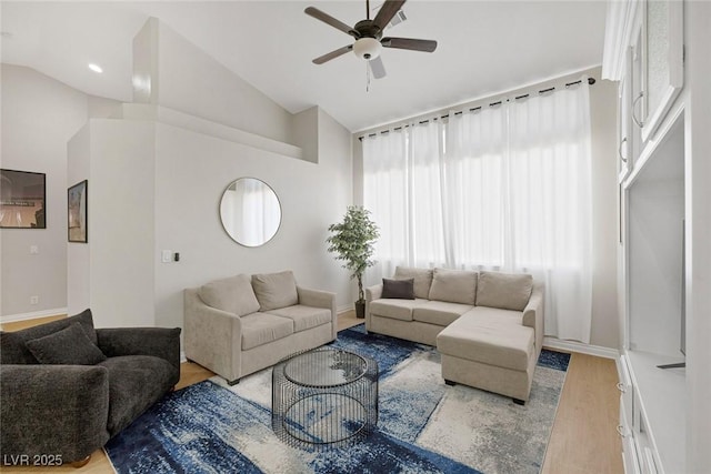 5512 Goldbrush St, Las Vegas, NV 89130 - living area featuring light wood-style flooring, ceiling fan, and high vaulted ceiling