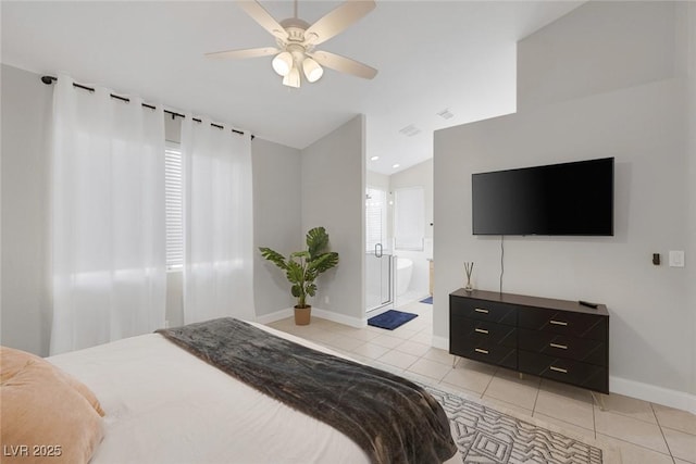 5512 Goldbrush St, Las Vegas, NV 89130 - bedroom featuring light tile patterned floors, vaulted ceiling, ceiling fan, and ensuite bathroom