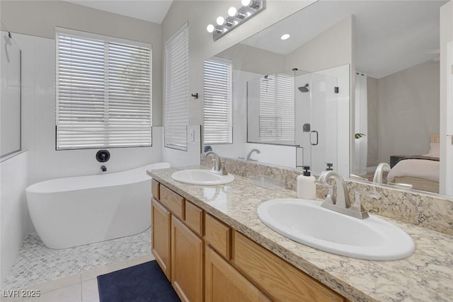 5512 Goldbrush St, Las Vegas, NV 89130 - bathroom with a shower stall, double vanity, a soaking tub, ensuite bath, and tile patterned floors