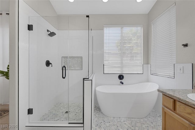 5512 Goldbrush St, Las Vegas, NV 89130 - full bathroom featuring a stall shower, a freestanding tub, vanity, and recessed lighting