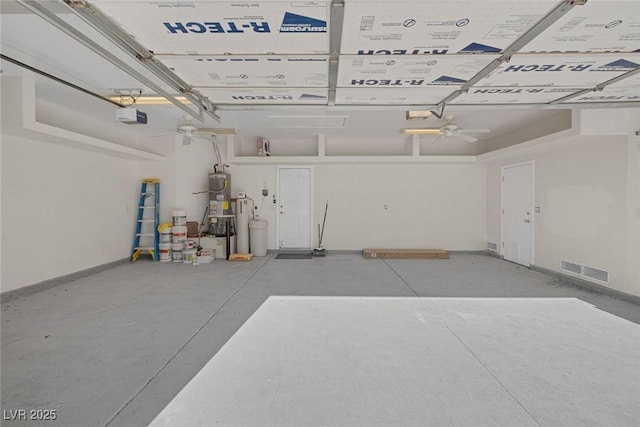 5512 Goldbrush St, Las Vegas, NV 89130 - garage featuring a garage door opener, strapped water heater, and a ceiling fan