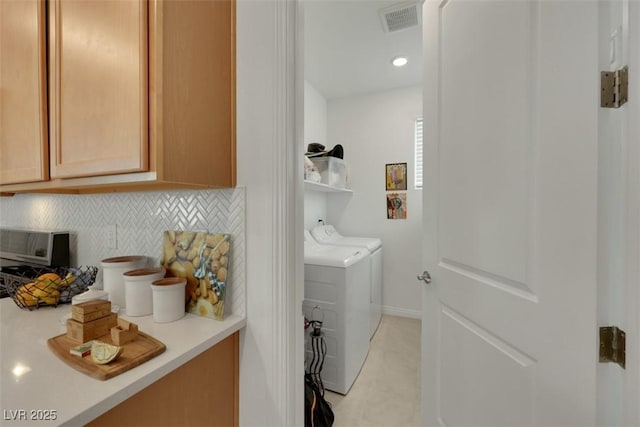 2261 Cold Canyon Ave, North Las Vegas, NV 89086 - laundry room featuring light tile patterned flooring and washer and dryer