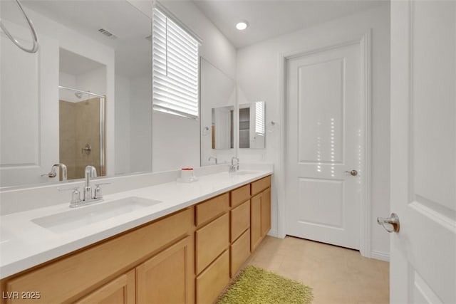 2261 Cold Canyon Ave, North Las Vegas, NV 89086 - full bathroom with tiled shower, double vanity, and tile patterned flooring