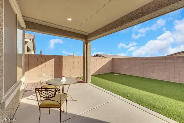 2261 Cold Canyon Ave, North Las Vegas, NV 89086 - fenced backyard featuring a patio area