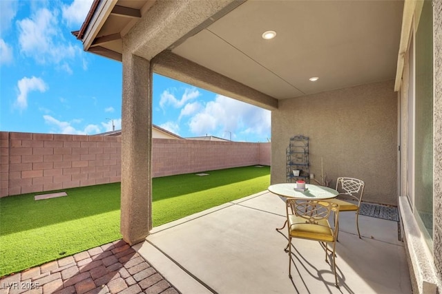 2261 Cold Canyon Ave, North Las Vegas, NV 89086 - fenced backyard with a patio area