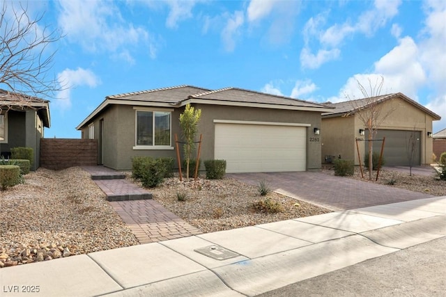 2261 Cold Canyon Ave, North Las Vegas, NV 89086 - single story home featuring stucco siding, driveway, a garage, and a tile roof