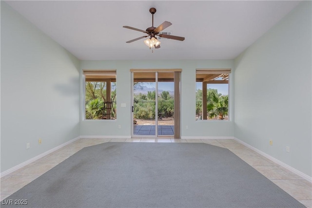 693 Hagens Aly, Mesquite, NV 89027 - empty room featuring plenty of natural light, tile patterned floors, and ceiling fan