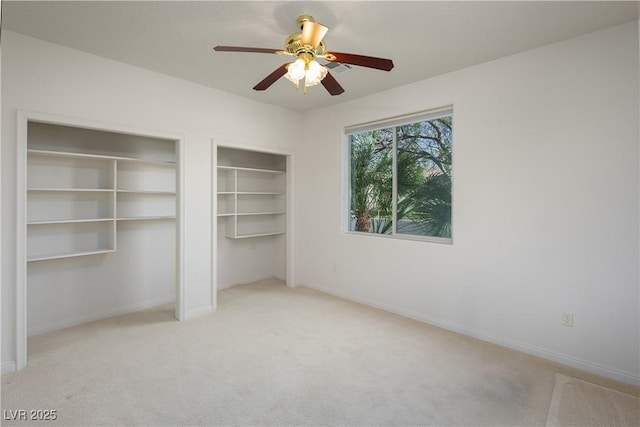 693 Hagens Aly, Mesquite, NV 89027 - unfurnished bedroom featuring multiple closets, carpet, and a ceiling fan