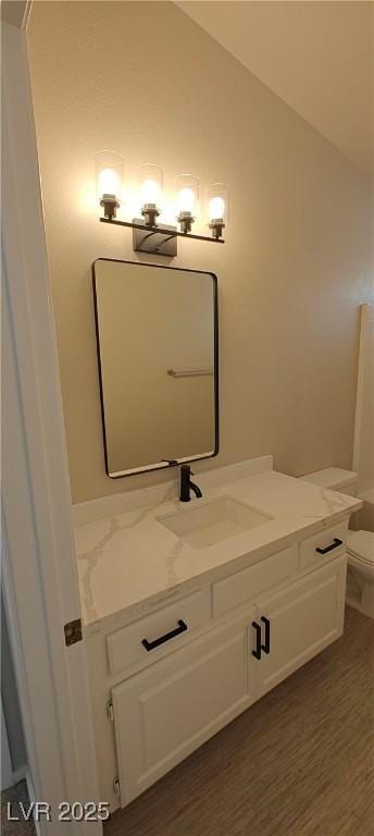 6615 Elk Creek Ln, Las Vegas, NV 89156 - bathroom with vanity and lofted ceiling