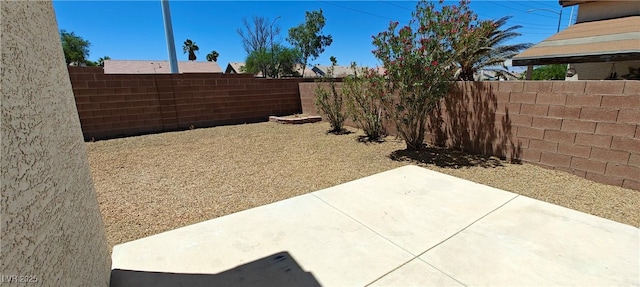 6615 Elk Creek Ln, Las Vegas, NV 89156 - fenced backyard with a patio