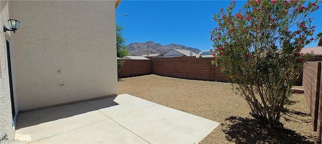 6615 Elk Creek Ln, Las Vegas, NV 89156 - fenced backyard featuring a patio area and a mountain view