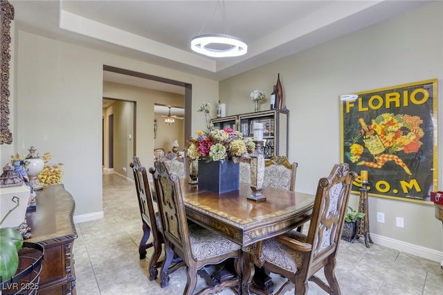 7286 Mount Kearsarge St, Las Vegas, NV 89131 - dining space featuring light tile patterned floors and a tray ceiling