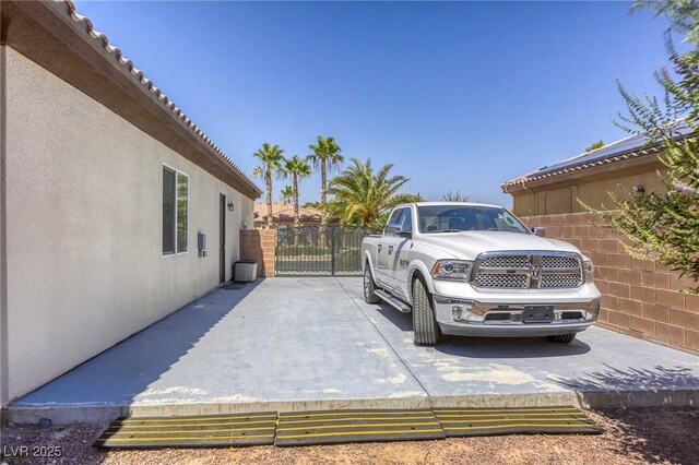 7286 Mount Kearsarge St, Las Vegas, NV 89131 - view of parking / parking lot featuring a gate