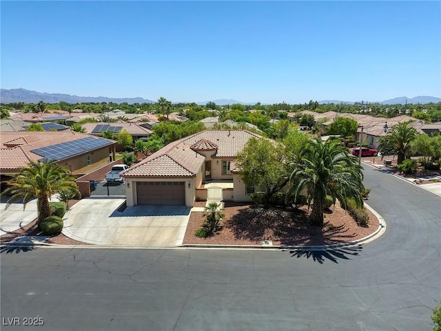 7286 Mount Kearsarge St, Las Vegas, NV 89131 - view of front of home with a garage, a residential view, driveway, a tile roof, and stucco siding