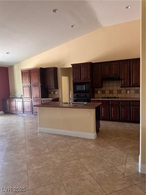 5005 Wild Thyme Ave, Las Vegas, NV 89131 - kitchen with black microwave, lofted ceiling, oven, dark countertops, and decorative backsplash