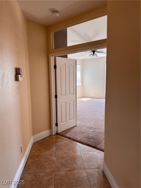5005 Wild Thyme Ave, Las Vegas, NV 89131 - hall with light colored carpet and light tile patterned flooring