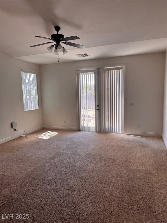 5005 Wild Thyme Ave, Las Vegas, NV 89131 - unfurnished room featuring ceiling fan, plenty of natural light, and carpet floors