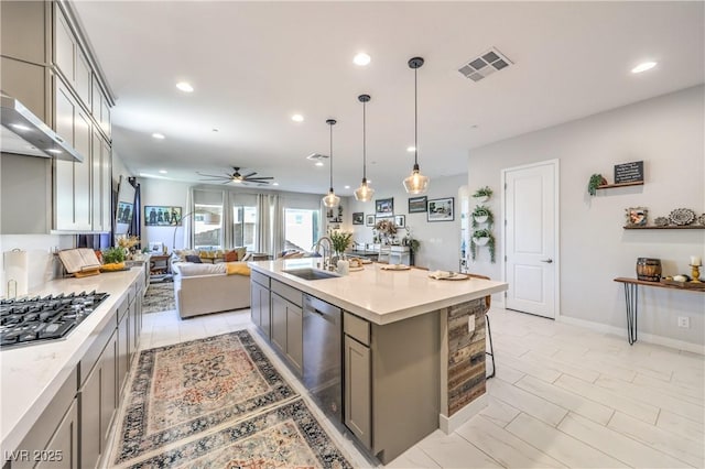 879 Klamath Springs St, Henderson, NV 89011 - kitchen featuring appliances with stainless steel finishes, gray cabinets, open floor plan, a ceiling fan, and light countertops