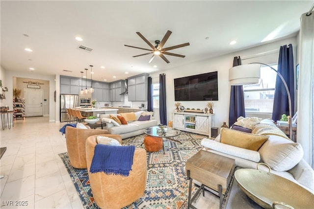 879 Klamath Springs St, Henderson, NV 89011 - living room featuring ceiling fan, light marble finish floors, and recessed lighting