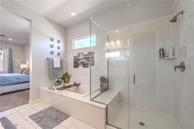 879 Klamath Springs St, Henderson, NV 89011 - ensuite bathroom with a stall shower, a garden tub, and marble look tiles