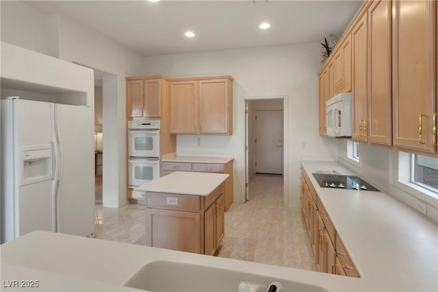 585 Mountain Links Dr, Henderson, NV 89012 - kitchen with white appliances, light brown cabinets, recessed lighting, light countertops, and a center island
