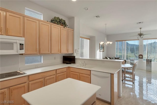 585 Mountain Links Dr, Henderson, NV 89012 - kitchen with white appliances, light brown cabinetry, healthy amount of natural light, and recessed lighting