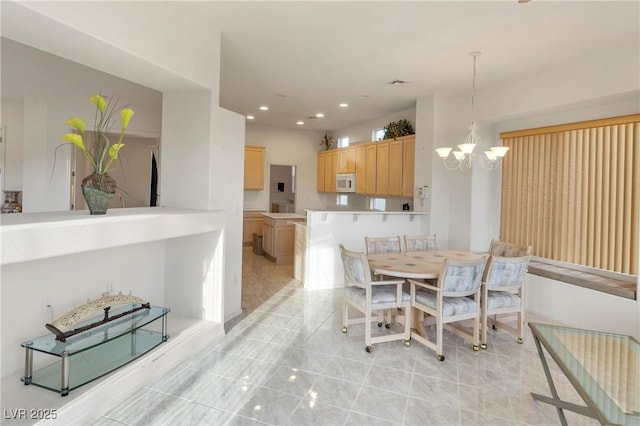 585 Mountain Links Dr, Henderson, NV 89012 - dining area with a chandelier, recessed lighting, and light tile patterned flooring