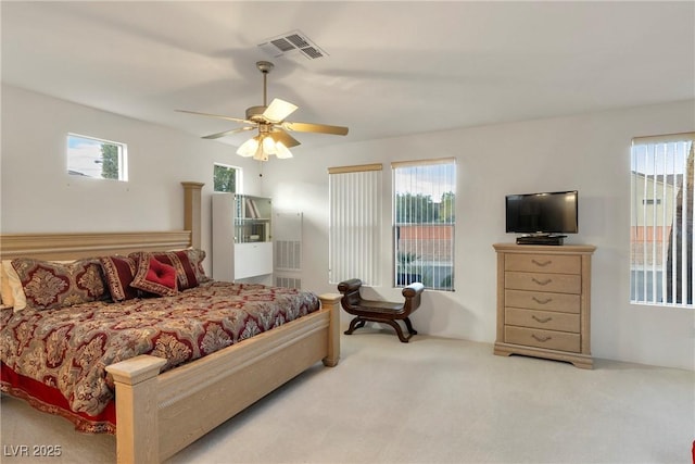 585 Mountain Links Dr, Henderson, NV 89012 - bedroom featuring multiple windows, carpet floors, and a ceiling fan