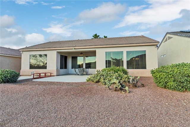 585 Mountain Links Dr, Henderson, NV 89012 - back of house with stucco siding and a patio
