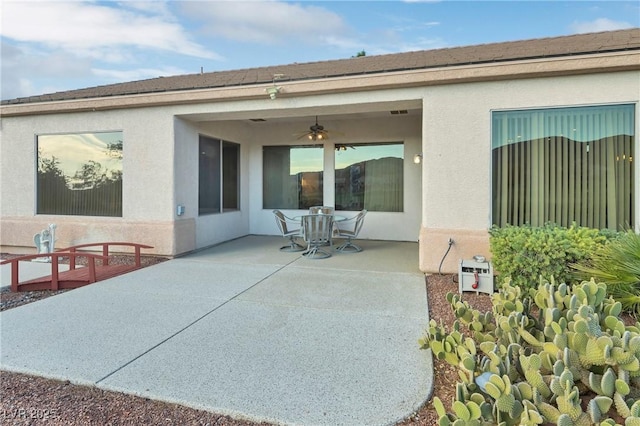 585 Mountain Links Dr, Henderson, NV 89012 - back of property featuring a patio area, a ceiling fan, and stucco siding
