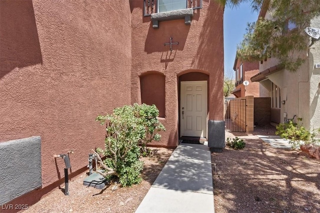 10918 Avenzano St, Las Vegas, NV 89141 - property entrance featuring a gate and stucco siding