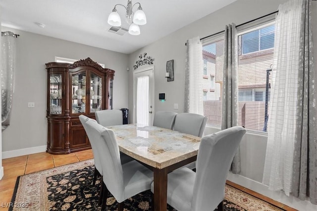 10918 Avenzano St, Las Vegas, NV 89141 - dining room with a chandelier, plenty of natural light, and light tile patterned flooring