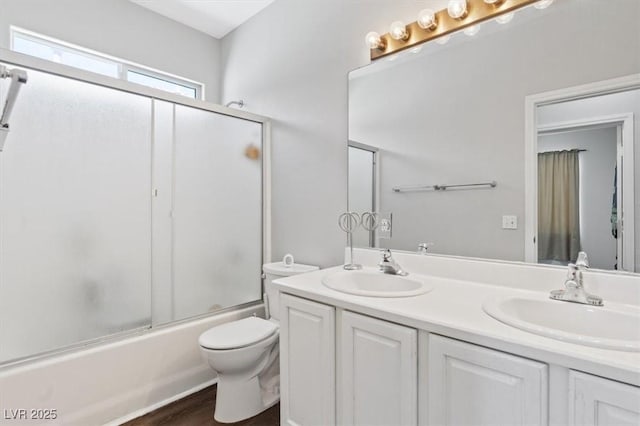 10918 Avenzano St, Las Vegas, NV 89141 - bathroom featuring double vanity, shower / bath combination with glass door, and wood finished floors