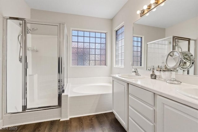 10918 Avenzano St, Las Vegas, NV 89141 - full bath featuring a stall shower, a bath, wood finished floors, and healthy amount of natural light