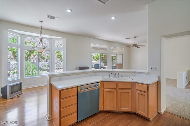 2413 Rockford St, Las Vegas, NV 89134 - kitchen featuring dishwasher, light wood-style flooring, light countertops, decorative light fixtures, and recessed lighting