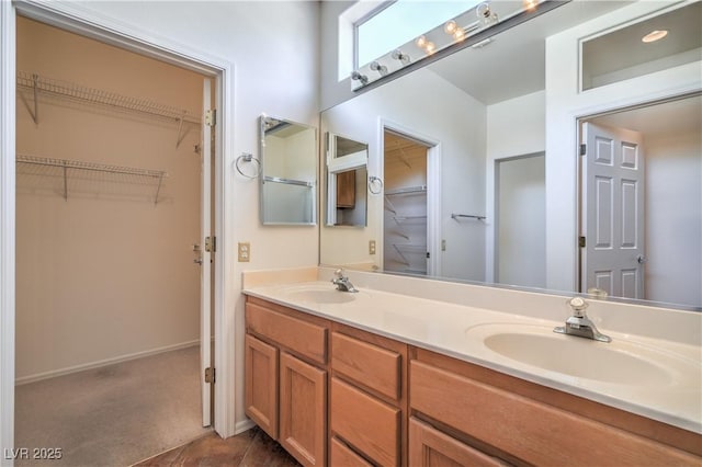 2413 Rockford St, Las Vegas, NV 89134 - bathroom with double vanity and a walk in closet