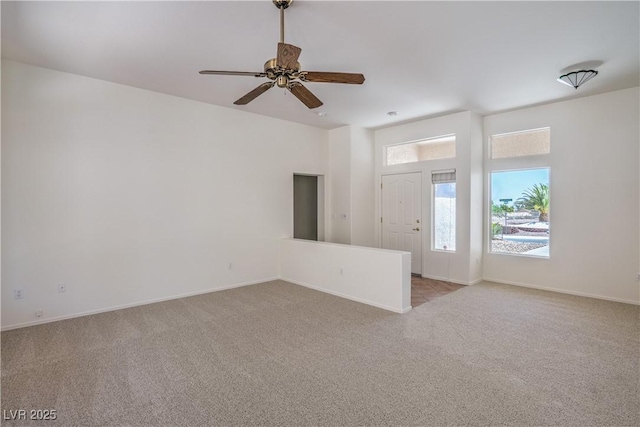 2413 Rockford St, Las Vegas, NV 89134 - unfurnished living room with light carpet and ceiling fan