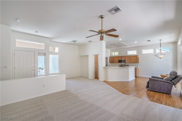 2413 Rockford St, Las Vegas, NV 89134 - living area featuring light carpet, a ceiling fan, and recessed lighting