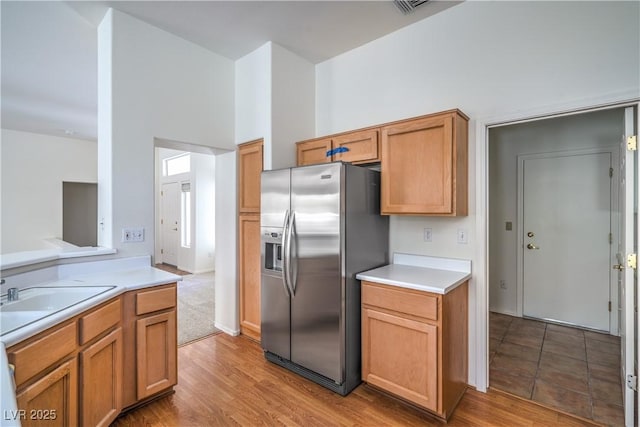 2413 Rockford St, Las Vegas, NV 89134 - kitchen featuring stainless steel fridge with ice dispenser, light countertops, and light wood finished floors