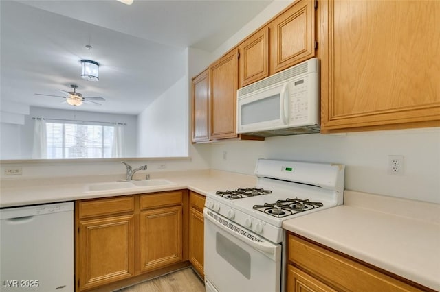 7163 S Durango Dr Unit 302, Las Vegas, NV 89113 - kitchen with white appliances, ceiling fan, light countertops, and brown cabinets